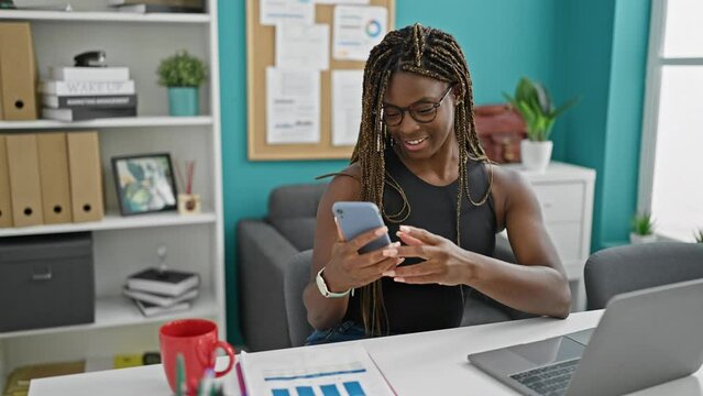 African american woman business worker make selfie by smartphone at the office