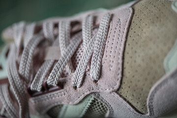 Fragment of original suede sports sneakers.