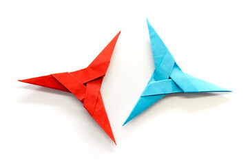 Origami Ninja 3 point star  on a white background. diy. paper craft. 