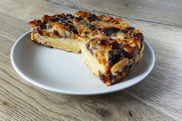 Tortela with nuts and raisins in a plate on the table