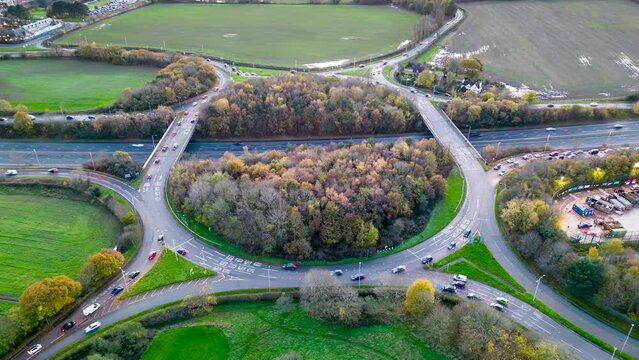 Aerial time-lapse view of M53 J4 Clatterbridge Interchange roundabout, Poulton, Wirral, Merseyside, England