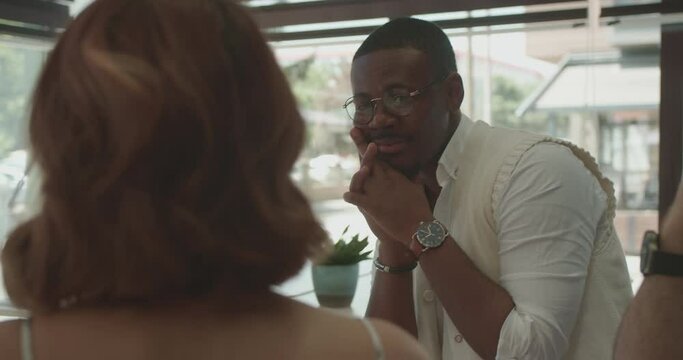 In a summer setting, a diverse group of business people of various races, ethnicities, are discussing issues related to their project and brainstorming. Reflecting teamwork and collaboration.