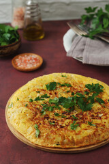 Frittata, traditional egg and potato omelette, Italian dish