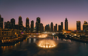 Fototapeta na wymiar Unique view of Dubai Dancing Fountain show at night. 