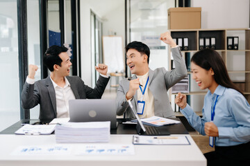 Group of Young Asian business team creative businesspeople coworker, teamwork celebrating achievement and in planning design in creative in office..