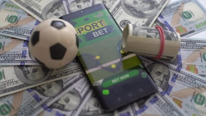 Monitor with champion cups, sport balls and gold coins in dark scene with neon rhombus frames and hologram of digital rings