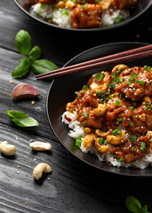 Crispy cashew Chicken stir fry with rice. Asian take away food