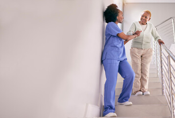 Nurse, stairs and help senior woman, holding hands and assistance in home. Caregiver, steps and...