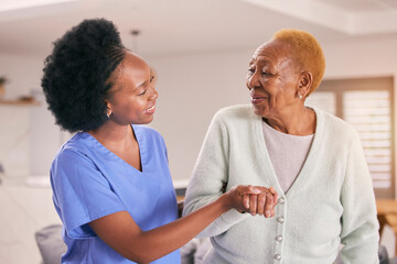 Help, nurse and holding hands of senior black woman, care and smile in house together. Caregiver,...