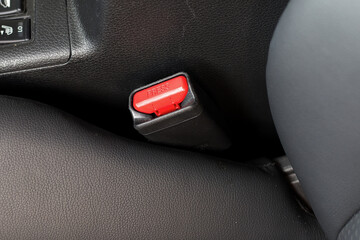 A seatbelt fastener