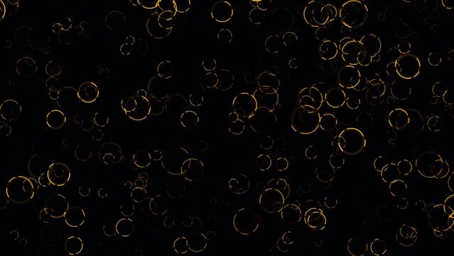 Beautiful loop falling gold ring circle on black abstract background.  Isolate using QuickTime Alpha Channel proress 444