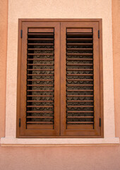 Traditional new brown window shutters as blinds in Europe