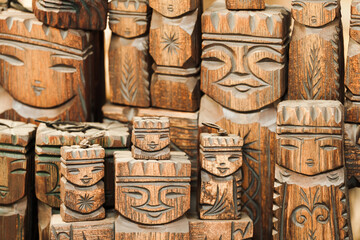 Carved wooden figurines in a row, handmade souvenirs