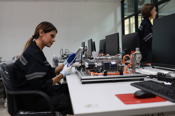 Two female mechatronic   engineer with expertise in prototype automatic, learning AI automation...