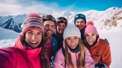 Group of friends taking selfie with mobile phone on snowy mountain in winter	