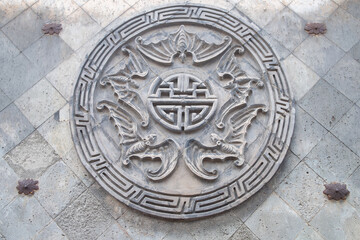 stone carving with bats horizontal composition