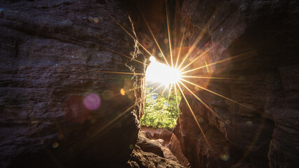 sun rays through a rock in the Palatinate Forest