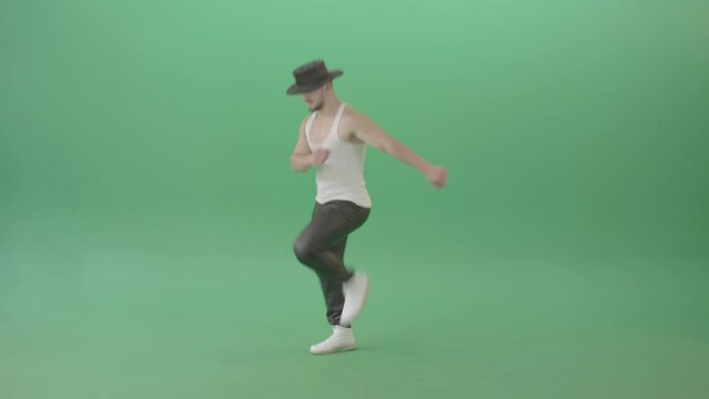  Sport Man in black hat dancing and marching fast isolated over Green Screen - 4K Video Footage