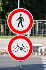 Two traffic signs forbidding entrance for pedestrians and cyclists as the crossing is reconstructed.