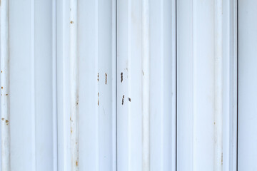 white and rusty car garage roller door