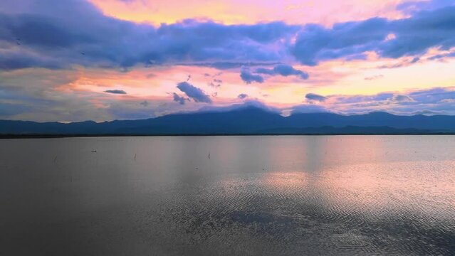 Aerial view of lake in the evening sunset. Beautiful relaxation at Phayao Province, Thailand.