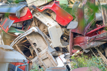 dump of old cars close-up