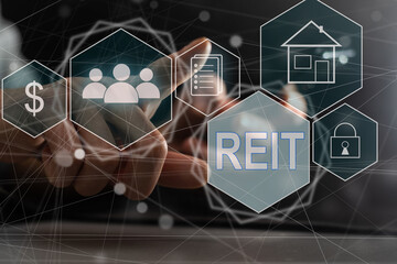 REIT, Real Estate Investment Trust concept, Person hand using smart phone with Real Estate Investment Trust icon on virtual screen.