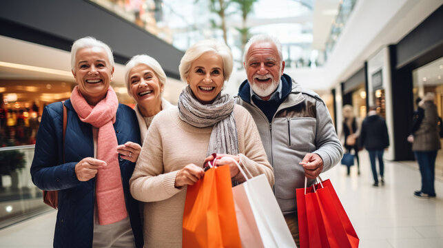 Joyful Seniors with Shopping Bags in a Mall Atrium, wide banner with copy space area, black friday, christmas present, gift,  