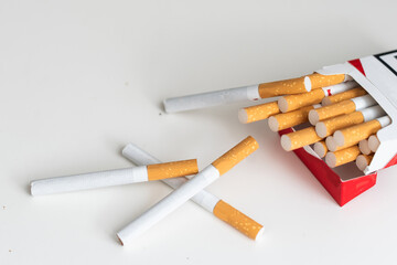 Tobacco smoking. Cigarette close-up, isolated on white background. Bad habit. Nicotine. Drug addiction. Cancer.