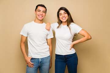 Attractive couple with white mock-up t-shirts