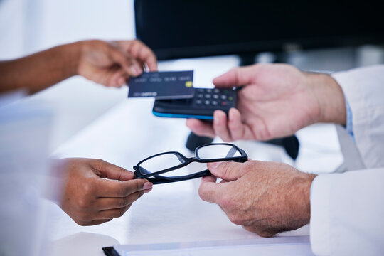 Shopping, Glasses And Payment With Hands Of People In Store For Medical, Retail And Eye Care. Medicine, Healthcare And Credit Card With Closeup Of Doctor And Customer For Purchase And Fintech