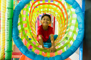 Cheerful kid having fun looking excited during recreation time
