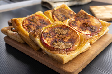 Puff pastry apple tarts  on black background.food concept. dessert. bakery