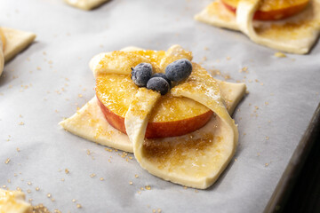 Puff pastry apple tarts  on black background.food concept. dessert. bakery