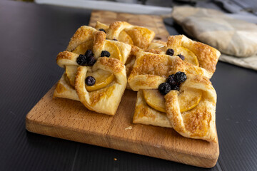 Puff pastry apple tarts  on black background.food concept. dessert. bakery