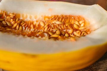half of ripe melon with seeds close-up