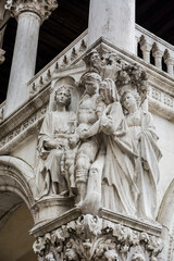 Fototapeta na wymiar Photo of a detailed statue on the facade of a building in Venice, Italy