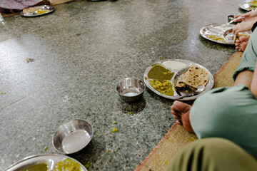 People voluntarily serving langar in India, Asia. Langar is a practice in Sikhism where free meal...