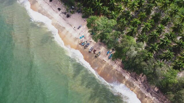 Tropical seas, beautiful turquoise waters, fishing boats stands on the seashore on a sandy beach. Prachuap khiri khan , Thailand. 