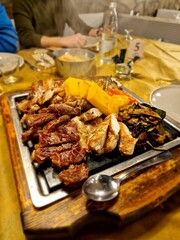 Plate of mixed grill with polenta and vegetables