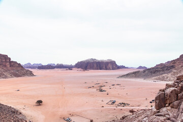 Fototapeta na wymiar A beautiful day in the Jordanian desert of Wadi Rum. wide dessert with amazing mountains and sand dunes, amazing scenery that you should see. High quality photo