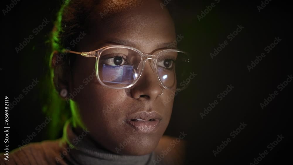 Wall mural close-up of the reflection of the computer screen on the glasses of a business woman working with a 