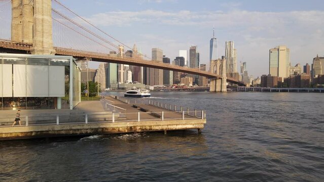 Establishing Shot of The Brooklyn Waterfront and Lower Manhattan at sunrise