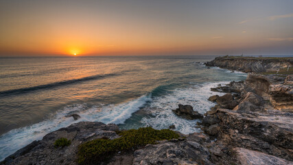 morning light on rocky cliff ocean 
