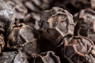 Peppercorns or black pepper spice. Super Macro Close Up.