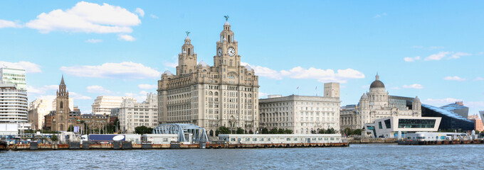 Panorama of iconic Liverpool Pier Head skyline featuring the Three Graces, the Royal Liver Building, the Cunard Building and the Port of Liverpool Building - obrazy, fototapety, plakaty