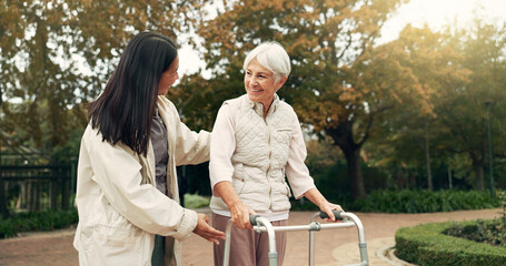 Park, walker and woman help senior walking as support, trust and care for morning healthcare...