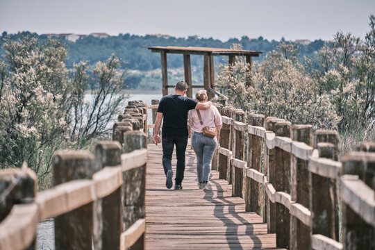 Couple on walkway, Lake Vrana, Croatia