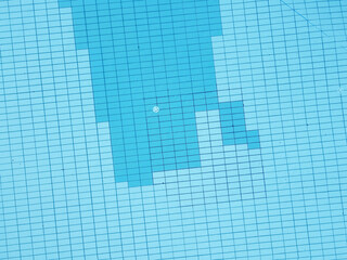 zenithal aerial view of a pool of clear water