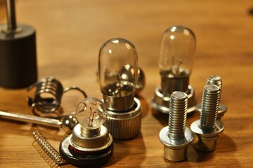 springs, screws and light bulbs on the table